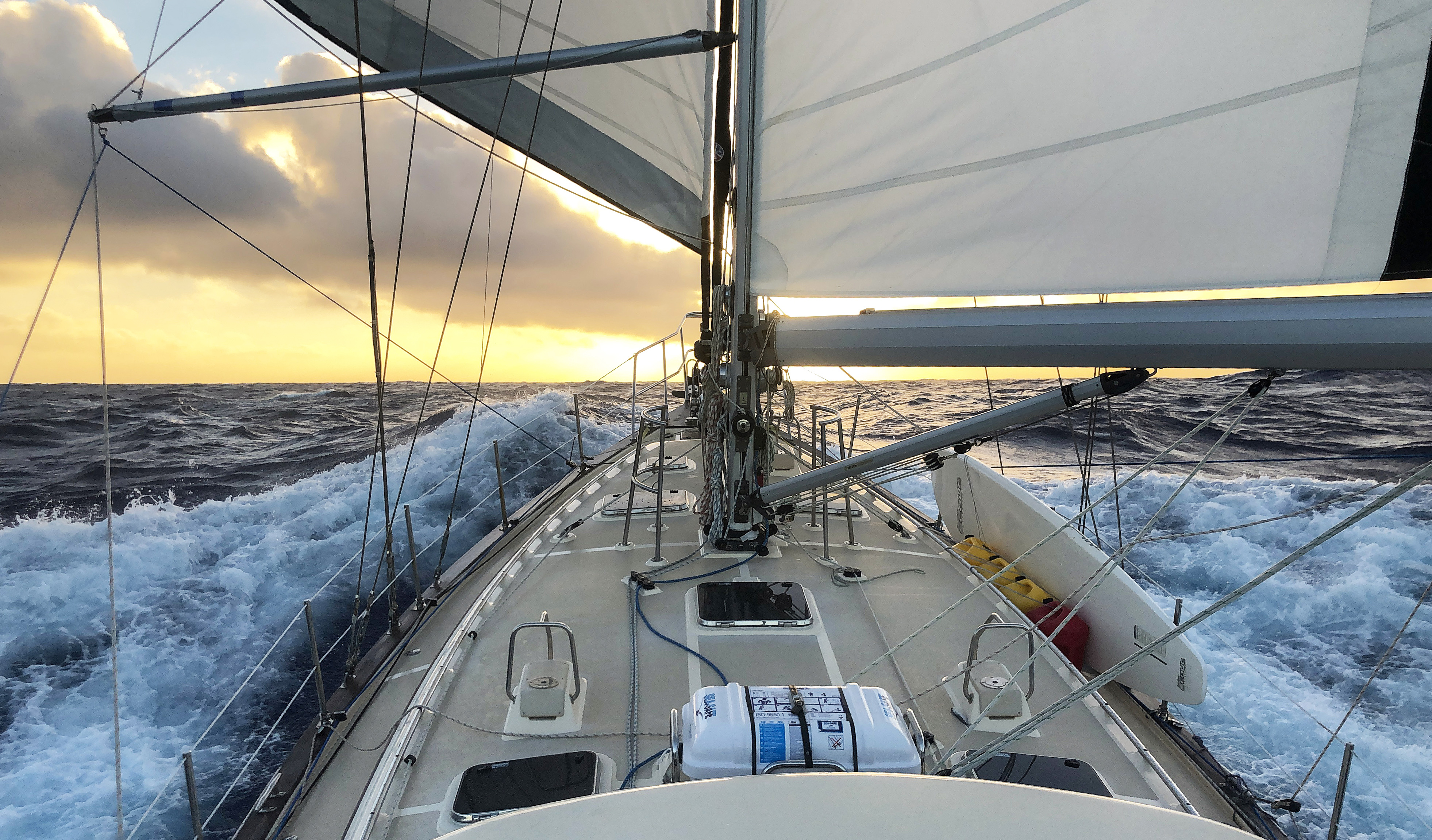 A surfboard glides effortlessly across the waves with a serene rider